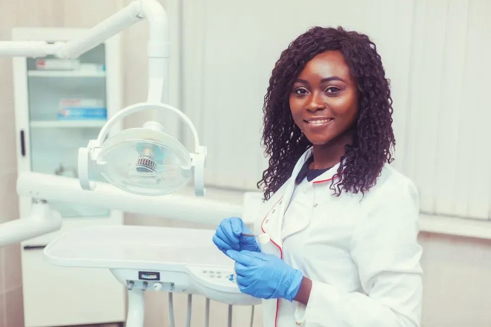 dentist-smiling-in-her-office