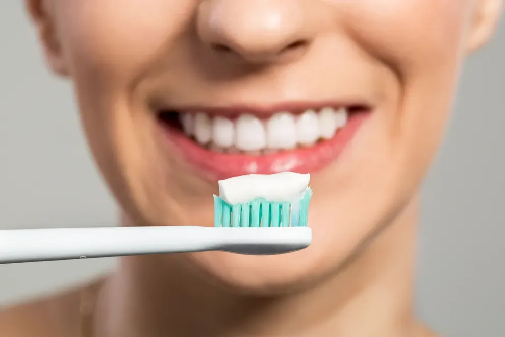 woman-whitening-toothpaste